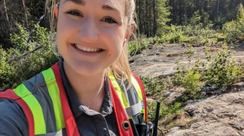 A female geology student conducting fieldwork 
